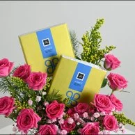 Fuchsia vase with chocolate bar from Patchi