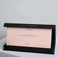 A bouquet of flowers with a gift card from Go Spa