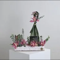 عطر نوار من فيرزاتشي مع زهور السمبيديوم