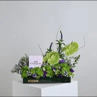 عطر فلورال من كوتش مع زهور الأنتيريوم