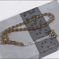 Father's gift Oud and prayer beads | With a vase of roses