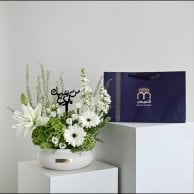 A vase that resembles you, my father, in white | With a thobe fabric from Al-Tamimi