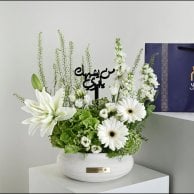 A vase that resembles you, my father, in white | With a thobe fabric from Al-Tamimi