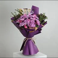 A bouquet of violet Christmas roses