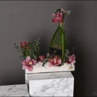 عطر نوار من فيرزاتشي مع زهور السمبيديوم