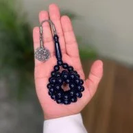 Vase with a rosary from Shakah