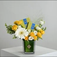 Yellow vase with chocolate bar from Patchi