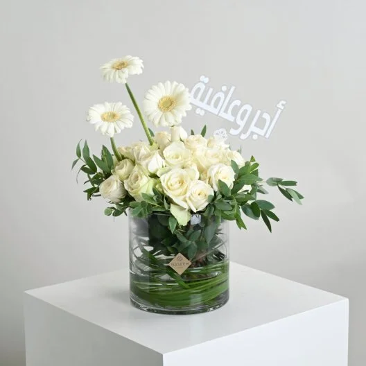 A vase with a reward and wellness tag
