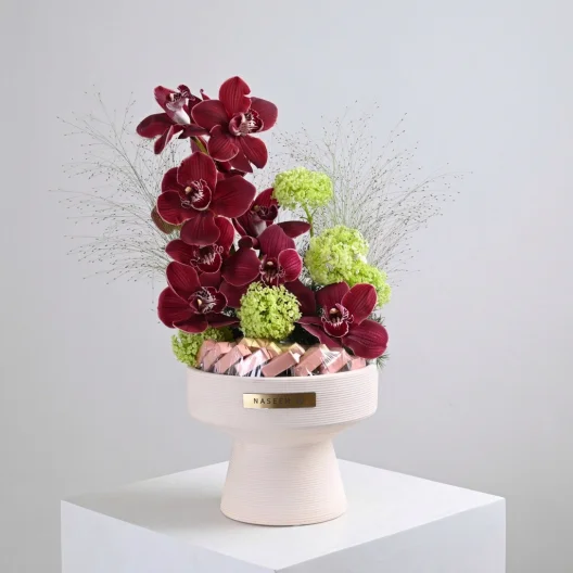 Red Cymbidium vase with Anoush chocolate