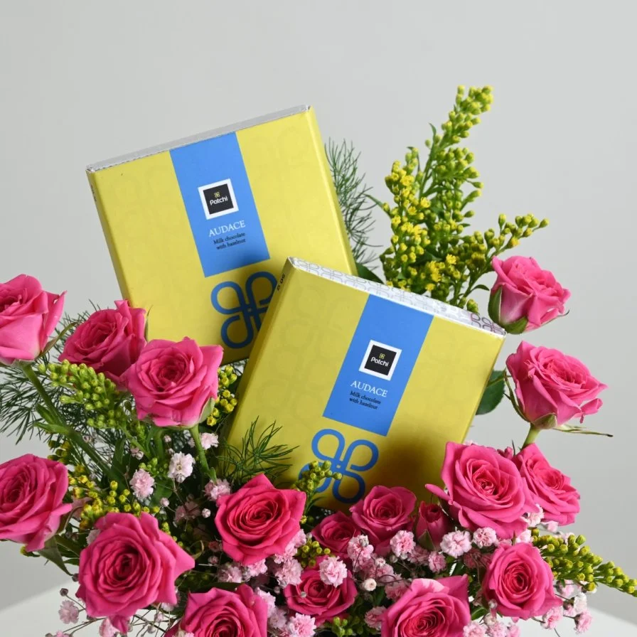 Fuchsia vase with chocolate bar from Patchi