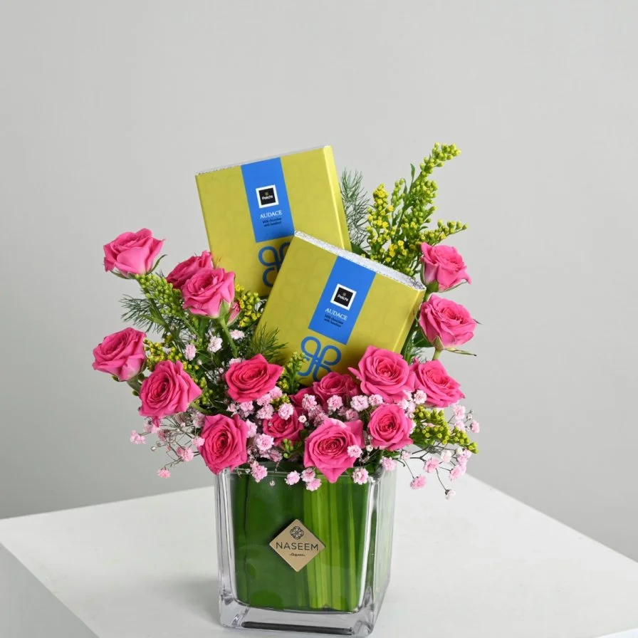 Fuchsia vase with chocolate bar from Patchi