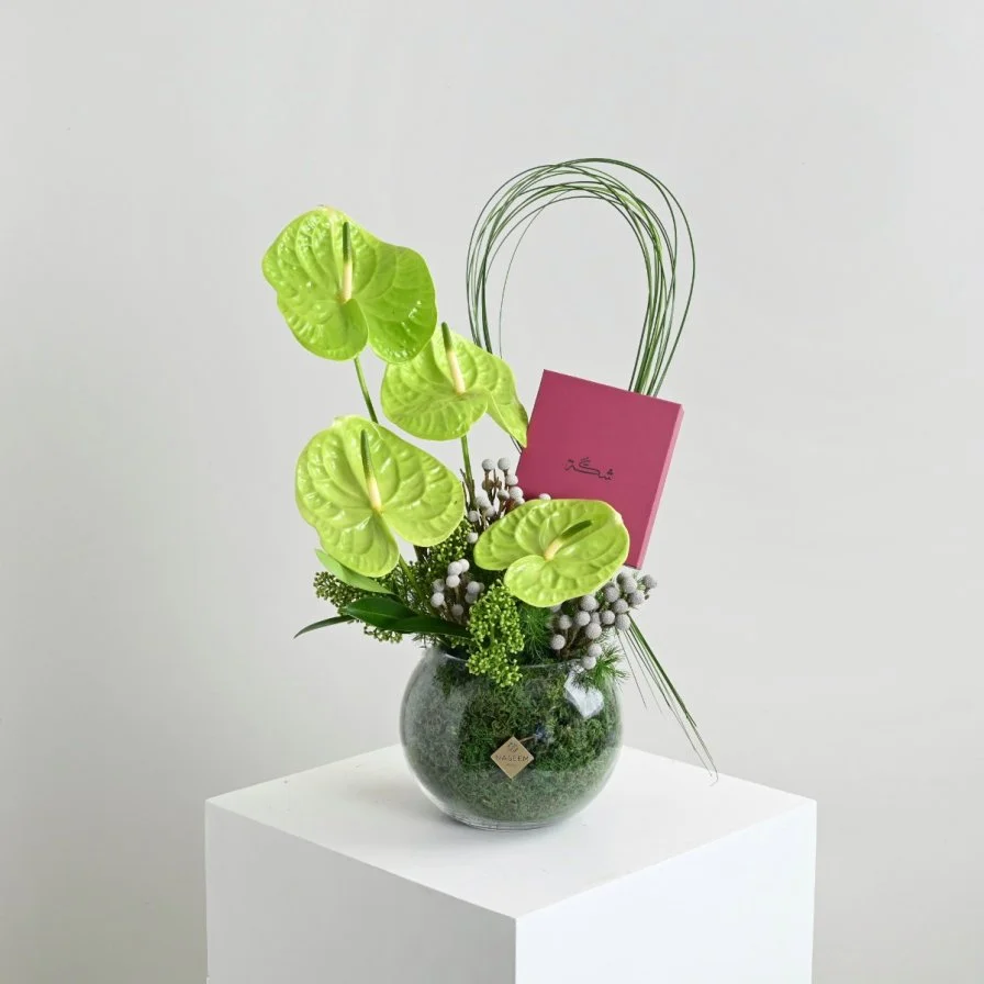 Green anthurium vase with a rosary from Shakah