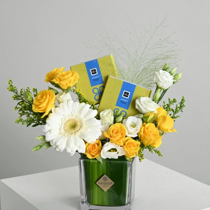 Yellow vase with chocolate bar from Patchi
