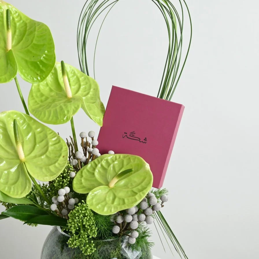 Green anthurium vase with a rosary from Shakah